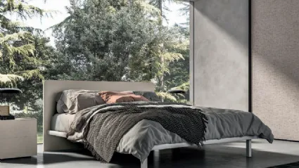 Letto matrimoniale con testiera stondata, materiali di qualità e finiture personalizzabili